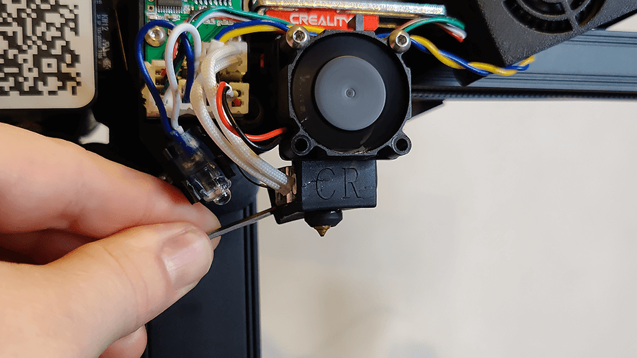 Remove silicone sock from hotend.